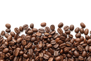 Roasted coffee beans on white background. Close-up.