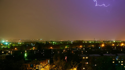 Lightning strike in the city Kyiv. Storm outside. Thunderstorm with lightning in the city. Moment...