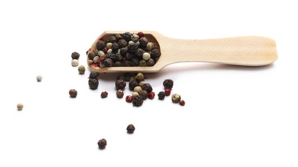 Colorful mixed pepper in wooden spoon isolated on white background