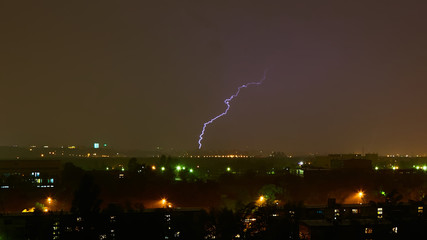 Lightning strike in the city Kyiv. Storm outside. Thunderstorm with lightning in the city. Moment...