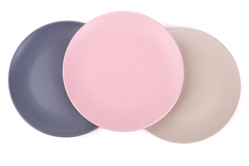 Three colorful plates on white background