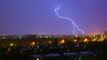 Lightning strike in the city Kyiv. Storm outside. Thunderstorm with lightning in the city. Moment...