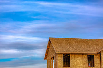 New home with cloudy sky background in Daybreak