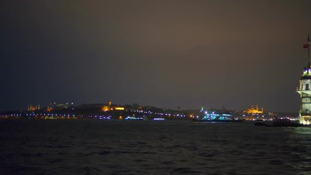 A slider night shot revealing the maiden tower in Bosphorus sea, Istanbul, Turkey.