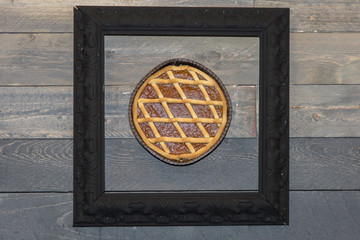 Apricot Jam Tart in a Frame, Wooden Background