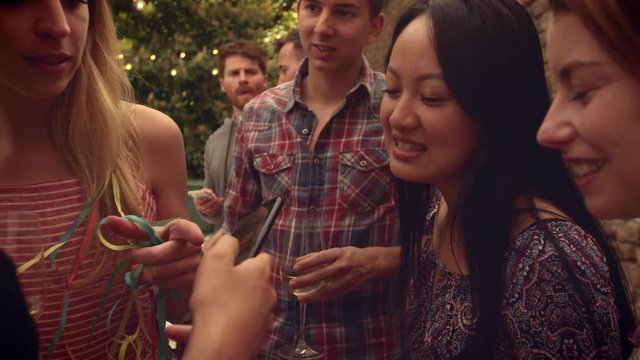 Group of friends watching something on a phone 