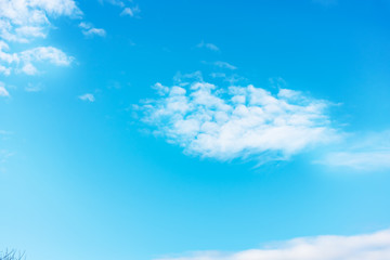 Fototapeta na wymiar Blue sky with white clouds. Daytime and good weather