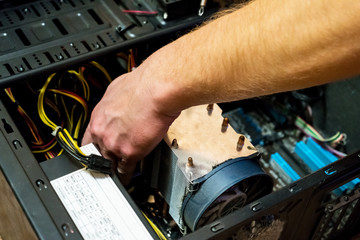 Computer literacy repairman hands clean the computer