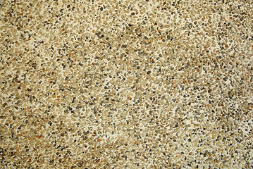 Old beige stone wall background texture