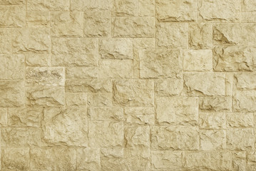 Old beige granite stone wall texture background