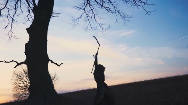 Grim Reaper sunset silhouette. concept of death. Soft focus