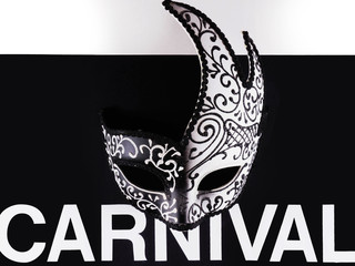 Carnival Venetian mask on a black background with creative typography. Carnival Brazilian party.