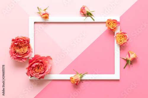 Happy Mother's Day, Women's Day, Valentine's Day or Birthday Pink Pastel Colored Background. Flat lay mock up greeting card with beautiful coral hue roses.