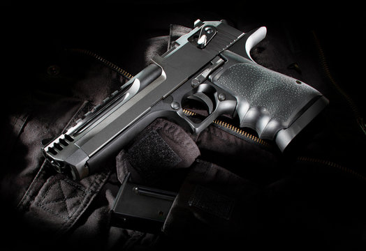 Black semi automatic handgun on a bag