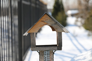 bird house in winter. empty on snow background