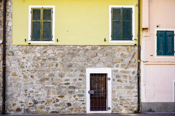 Fototapeta na wymiar old colored small house's facade