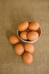 A dozen of eggs shot with gunny sacks as background. This shot was taken layflat.