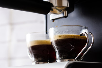 Close up fresh coffee in espresso coffee machine