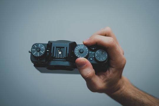 hand holding digital camera