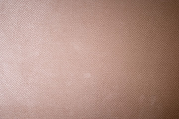 Textured background surface of textile upholstery furniture close-up. burlap beige color fabric structure