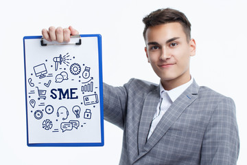Business, technology, internet and networking concept. Young entrepreneur showing keyword: SME