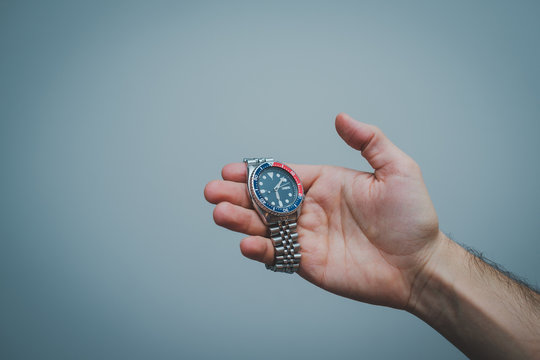 Mens wristwatch in hand
