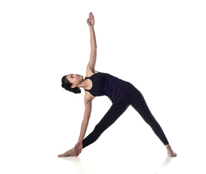 Sporty young woman doing yoga practice isolated on white background - concept of healthy life and natural balance between body and mental development ,with clipping path - Image