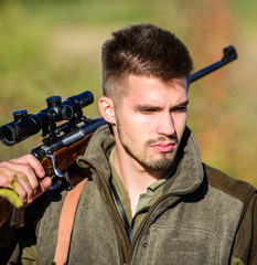 Man hunter with rifle gun. Boot camp. Bearded man hunter. Army forces. Camouflage. Military uniform...
