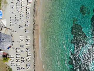 Aerial view of the Caribbean Sea with beach chairs at Reggae Beach near Christopher Harbor, Saint...