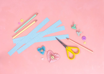 Scrapbooking master class. Diy. Make a Valentines day card whith paper hearts. Women's hobby. Craft supplies on the table.