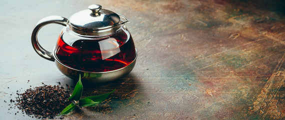 Transparent glass teapot black tea and glass cups