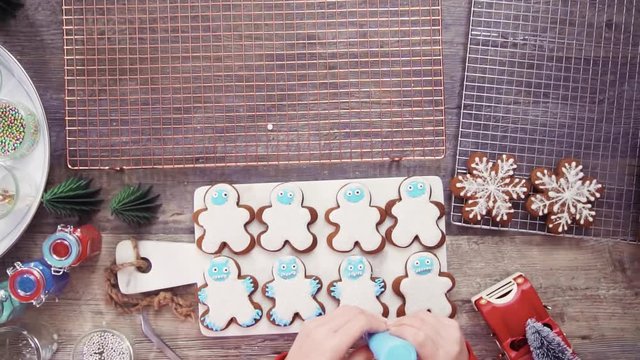 Step by step. Flat lay. Decorating gingerbread cookies with royal icing.