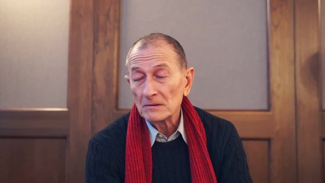 Businessman presentating business company. Senior man speaks to camera.