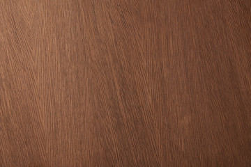 Top view of brown desk surface with wooden texture