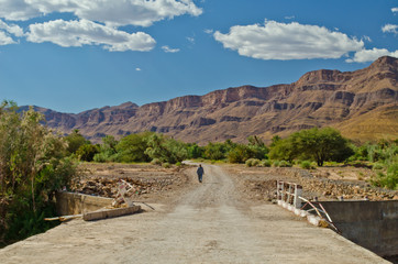Big oasis with palm trees in Draa Valley between Sahara desert and Atlas Mountains, Morocco