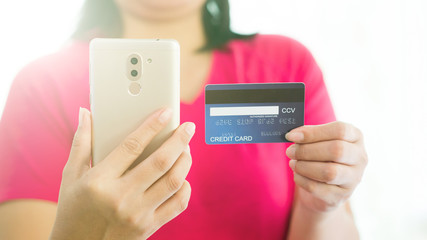Buy products online By using a mobile phone and paying using a credit card. - Image