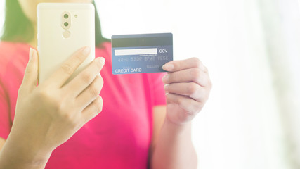 Buy products online By using a mobile phone and paying using a credit card. - Image