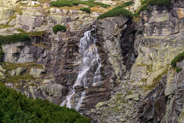 Waterfall jump in Mlynicka Valley. High Tatras. Slovakia.