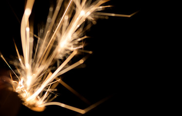 Lighters with flame sparking on dark background. Selective focus and shallow depth of field.