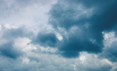 Stormy cloud on grey sky. Cloudscape photo background. Moody skyscape with rain cloud. Stormy cloudiness banner template