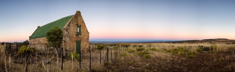 Fototapeta na wymiar Wide angle view of old abandoned farm buildings on a farm in the Northern Cape of South Africa