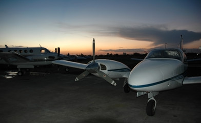 airplane parked at dusk