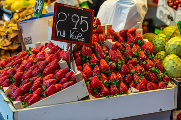 fresh strawberries in the market with price tag