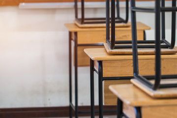 Back to school concept. School empty classroom, Lecture room with desks and chairs iron wood for studying lessons in highschool thailand without young student, interior of secondary education