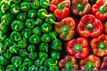 Green and red peppers in pile
