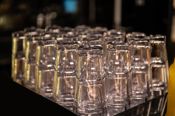 Row of empty glass of water set on the bar in kitchen for celebration.
