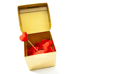Gift box with red hearts on an isolated background