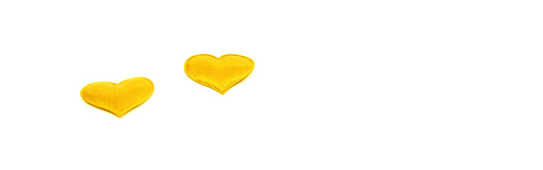 Yellow heart on an isolated white background as a panorama, space for text.
