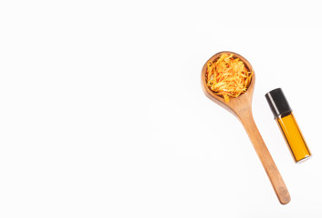 Calendula essential oil bottle - Calendula officinalis. White background