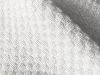 close up beautiful white cloth background with dots emboss, texture of white towel decoration with whit dot emboss, bright color of pattern on thickness white fabric, abstract classic design of cloth